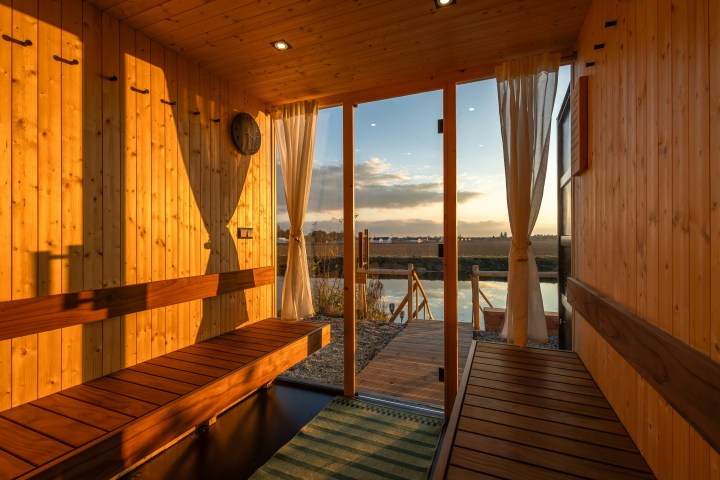 a wooden pier next to water